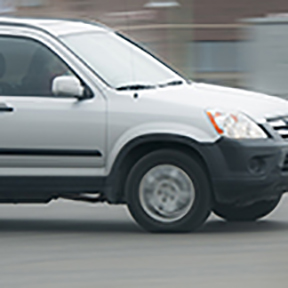 Motion blur image of sliver mid-size vehicle